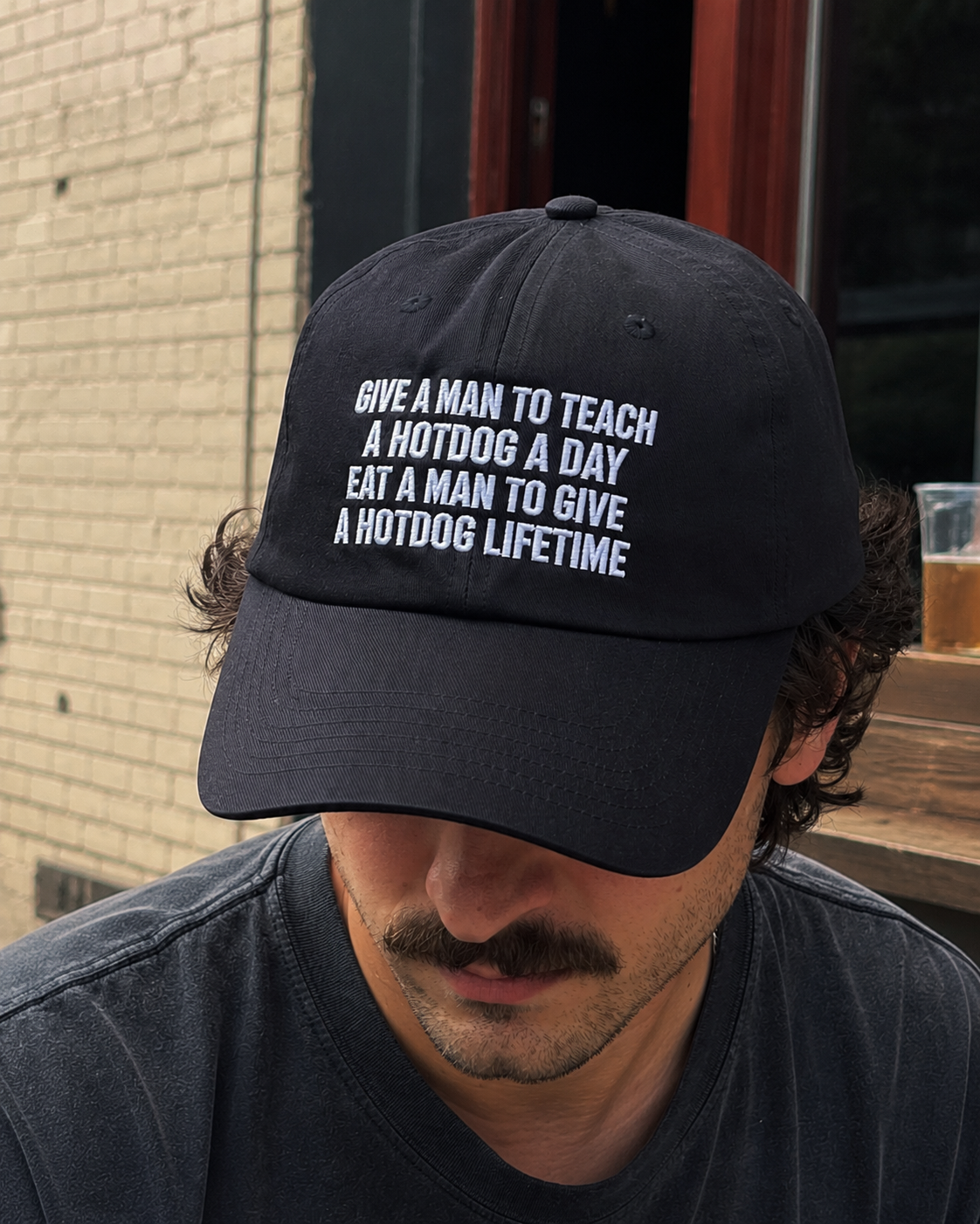 Give A Man To Teach A Hotdog A Day Hat | Embroidered Dad Hat